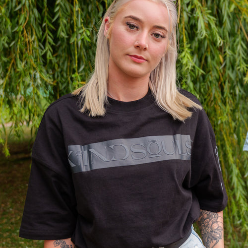 Black oversized KiiNDSOULS Whatever It Takes graphic T-shirt, lifestyle view