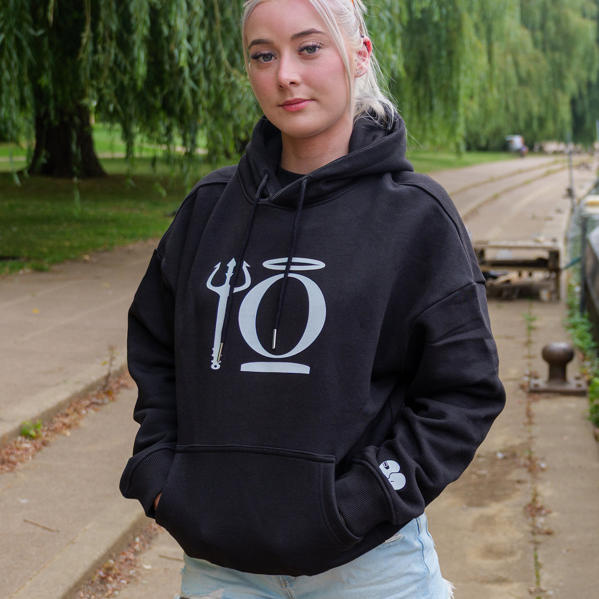 Black oversized KiiNDSOULS Halo hoodie, front lifestyle view