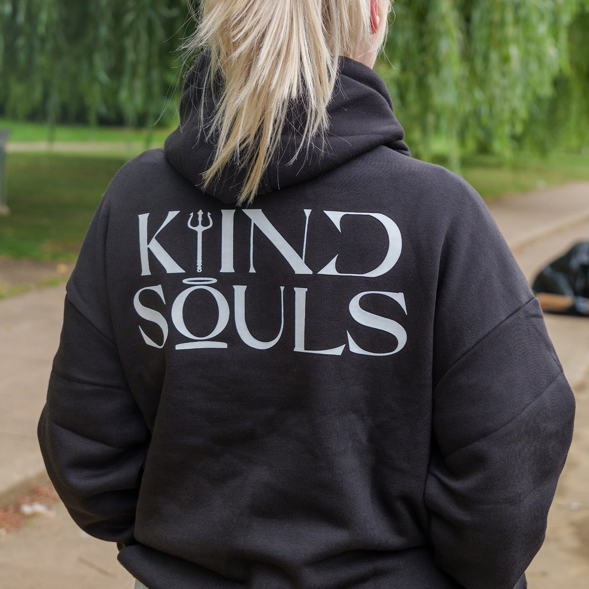 Black oversized KiiNDSOULS Halo hoodie, back lifestyle view